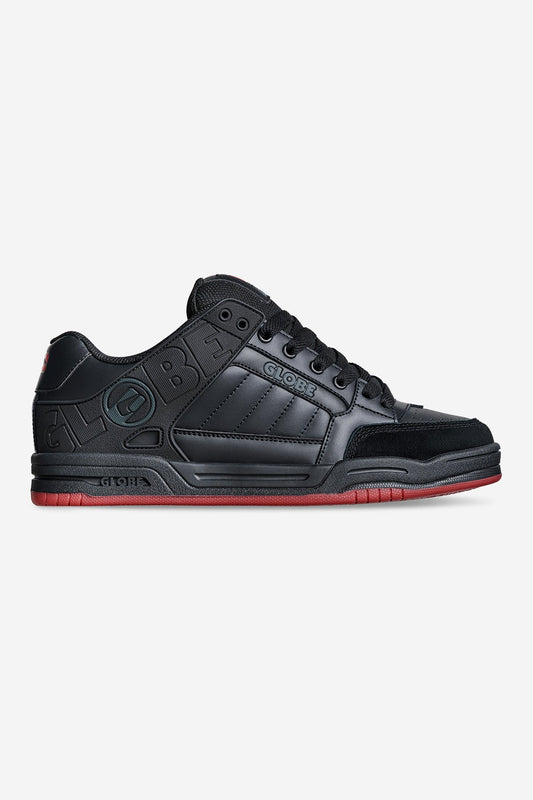 globe tilt Black sneaker with white sole on a white background