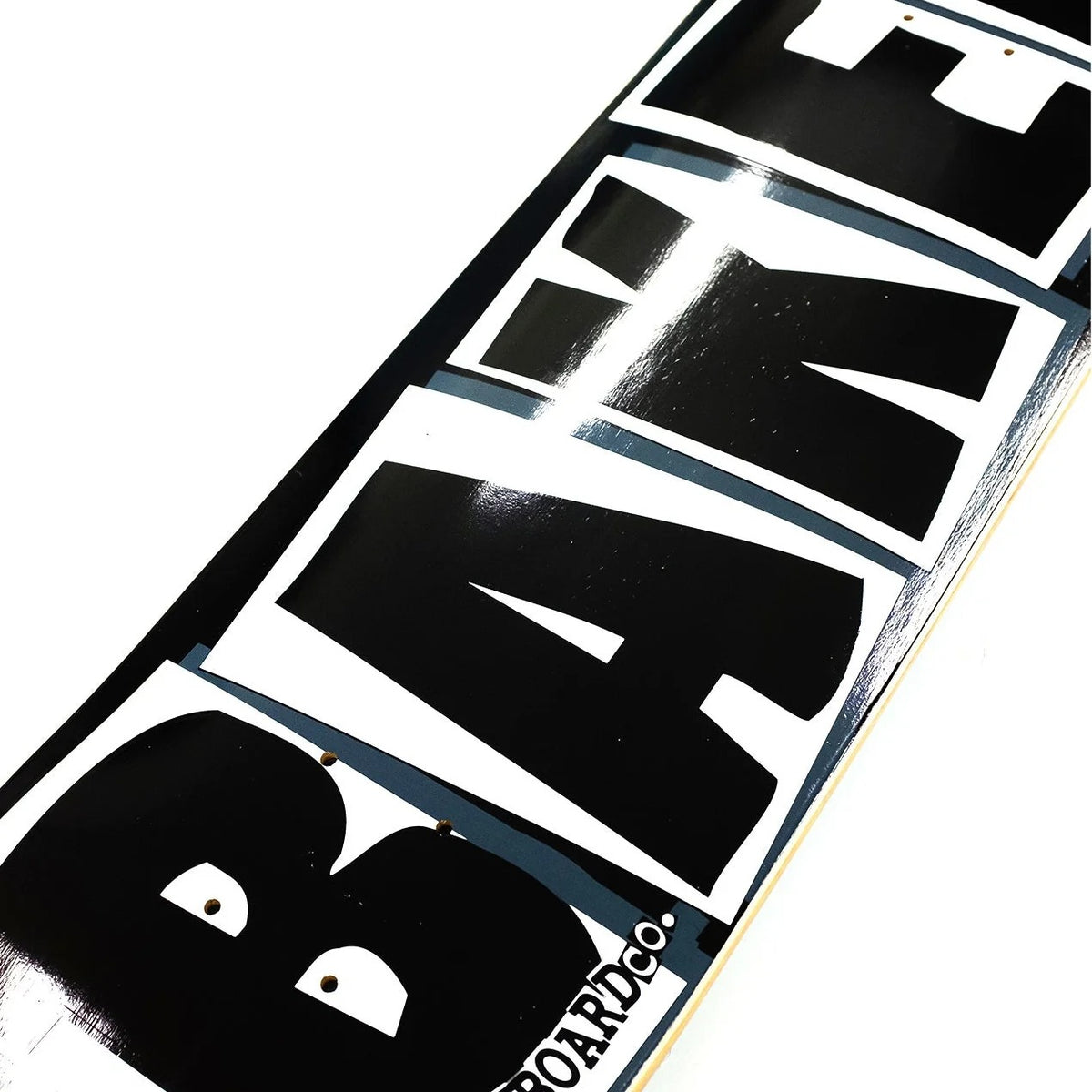 Close-up of a skateboard with 'BAKER' branding on a white background