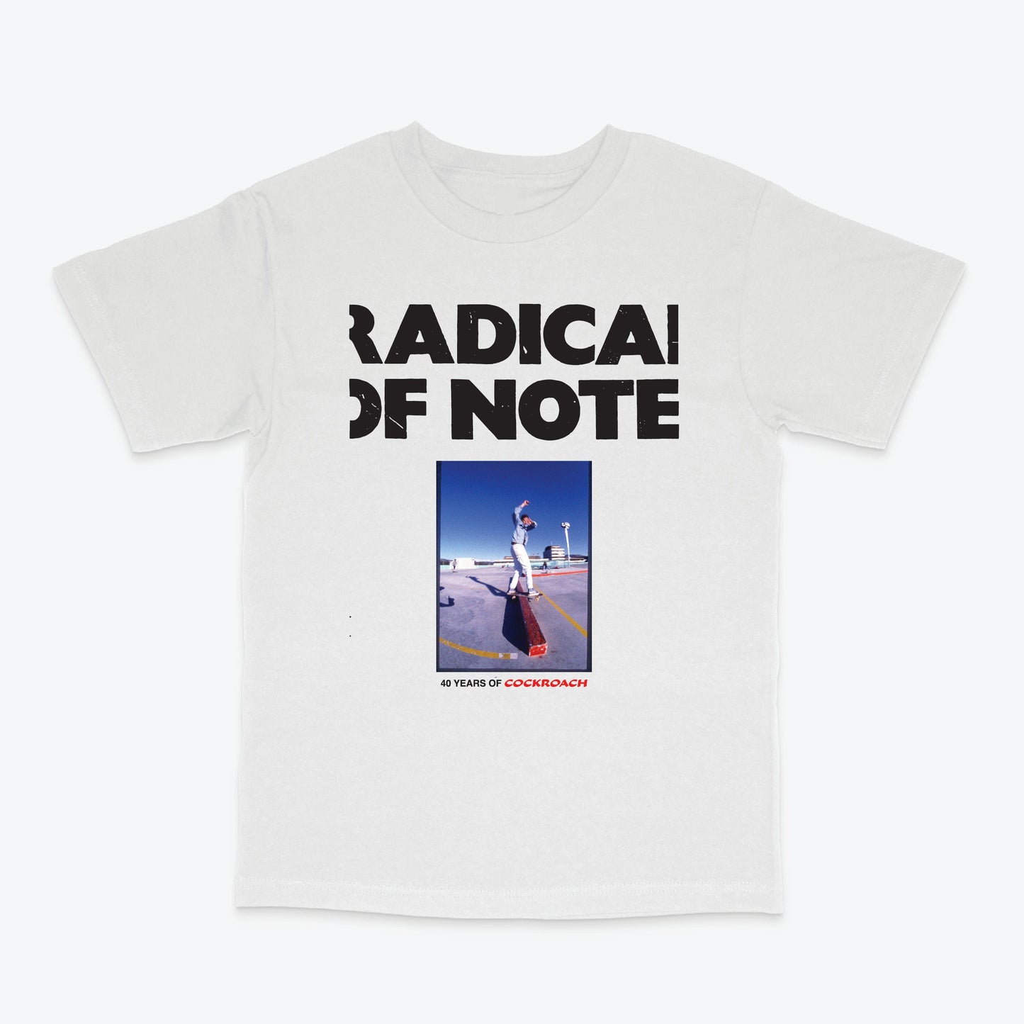 A white short-sleeve crewneck t-shirt featuring a black graphic print that reads 'RADICAL OF NOTE' above a square photo of a person skateboarding on a ramp, with '40 YEARS OF CORKINBOYZ' printed below.