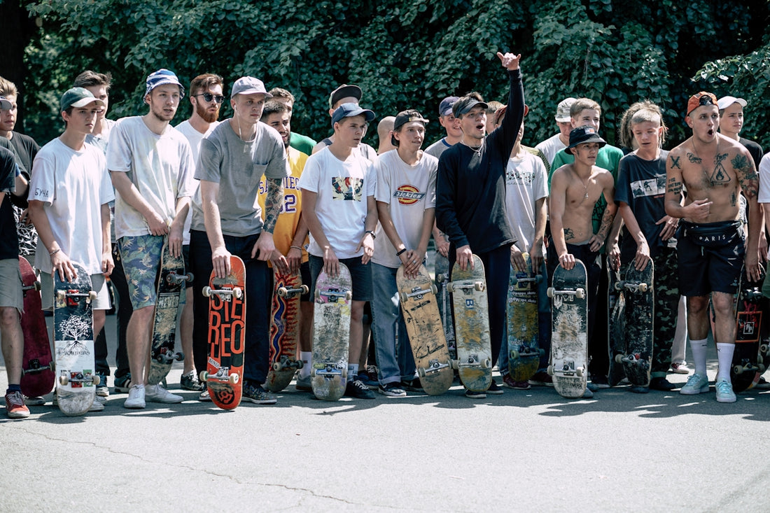 people holding skateboards