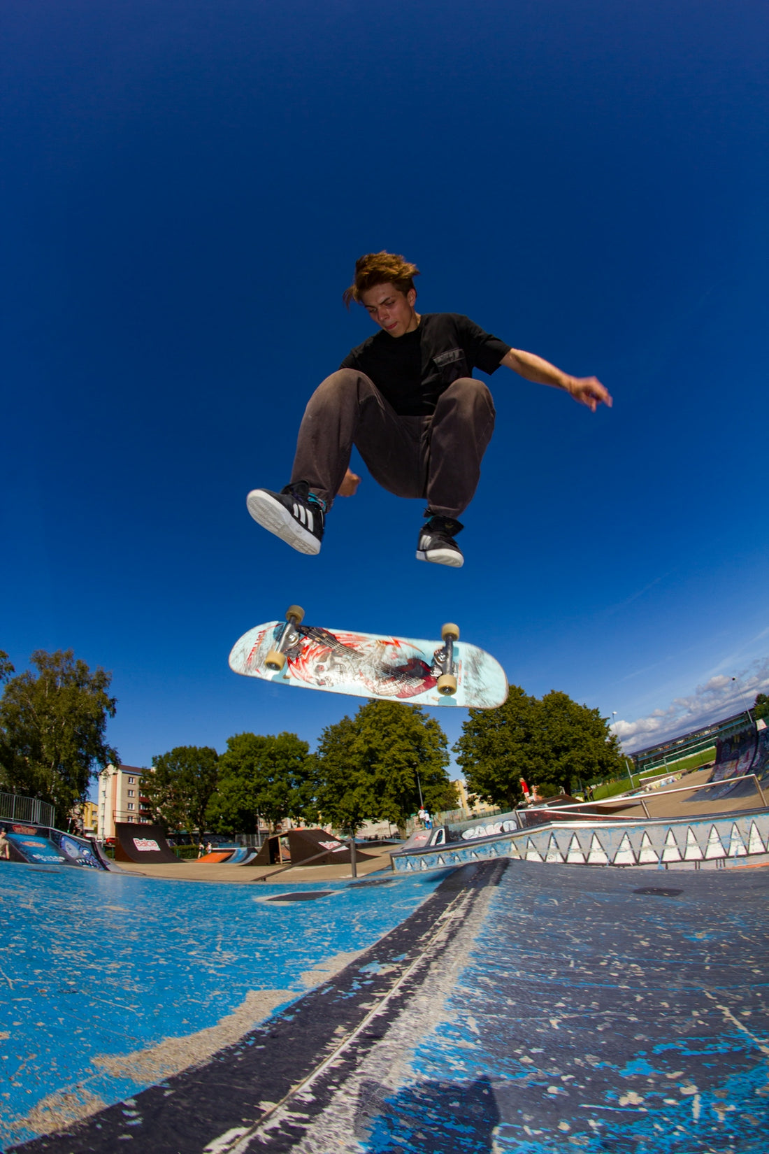 A man flying through the air while riding a skateboard