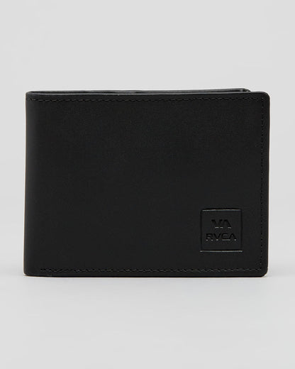 A black bi-fold wallet made of textured leather with a debossed square logo patch on the bottom right corner that reads 'VA RVCA', set against a plain light gray background.