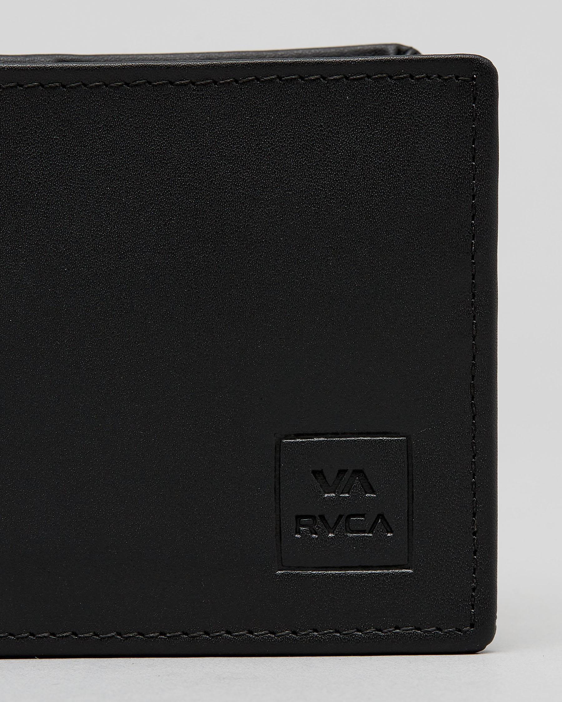 Close-up of a black leather bi-fold wallet showing the corner, black stitching, and an embossed square logo patch with 'VA RVCA' on a light gray background. cedar bifold