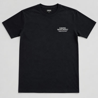 A black short-sleeve t-shirt with a small white graphic on the left chest reading 'KINGPIN SKATE SUPPLY' displayed flat against a white background.