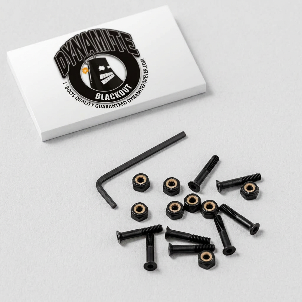 Black hardware kit with black screws, black hex nuts, and a black L-square wrench, arranged on a light gray surface next to a white branded box. The box shows the Dynamite Blackout logo.