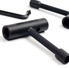 Close-up of black hex keys on a white background