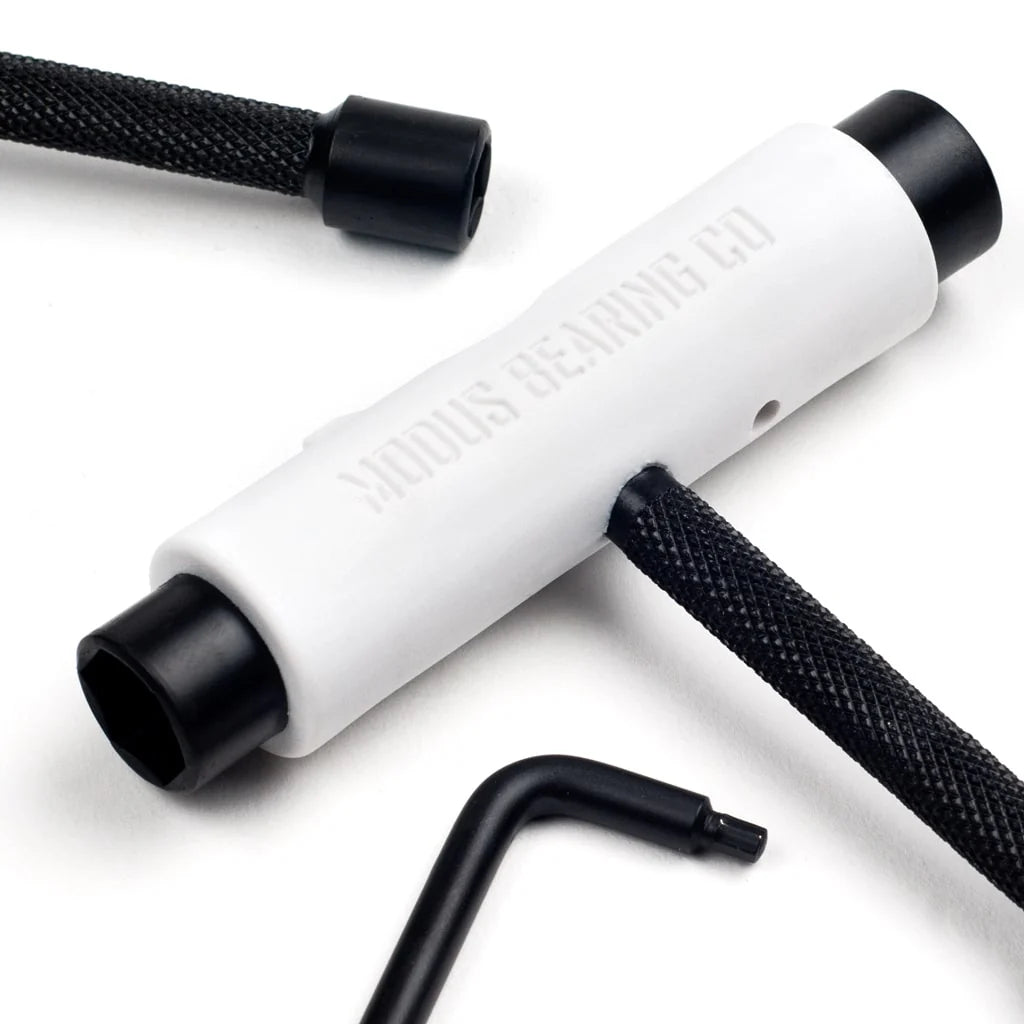 White tool with black accents on a white background