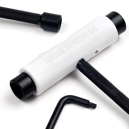 White tool with black accents on a white background