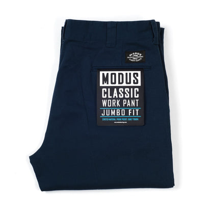 A folded pair of dark navy blue work pants with a prominent black and white 'Modus Classic Work Pant Jumbo Fit' label on the back pocket, set against a plain white background.