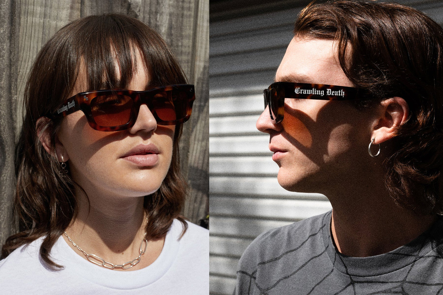 Two models wearing black-framed sunglasses with orange-tinted lenses. The left model has brown hair and is wearing a white top against a wooden wall, while the right model has dark hair and is wearing a gray shirt against a corrugated metal wall.