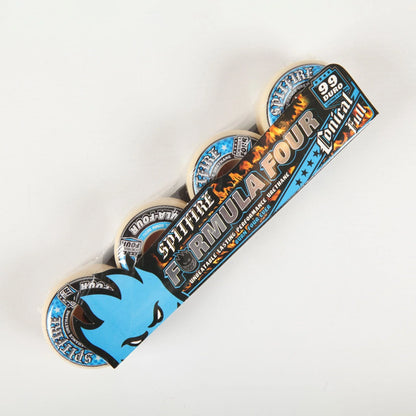 A set of four skateboard wheels in their original retail packaging, featuring a black and blue cardboard sleeve with flame graphics and the text FORMULA FOUR'.