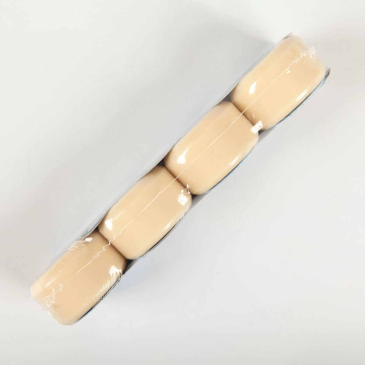 Four Spitfire Formula Four conical full wheels wrapped in clear plastic, arranged diagonally on a plain white background.
