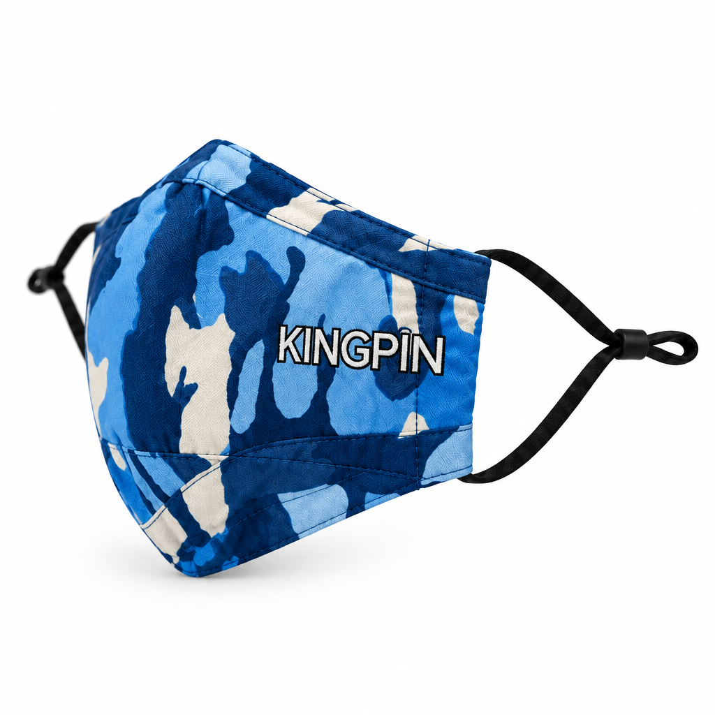 A blue and white camouflage face mask with the brand name 'KINGPIN' printed in white with a black outline on the front, featuring black elastic ear loops, set against a plain white background.