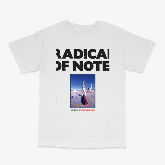 A white short-sleeve crewneck t-shirt featuring a black graphic print that reads 'RADICAL OF NOTE' above a square photo of a person skateboarding on a ramp, with '40 YEARS OF CORKINBOYZ' printed below.