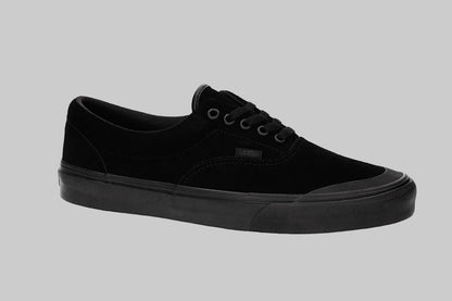 A black Vans era sneaker with a thick black sole, black laces, and a black canvas upper, shown from a side profile on a white background.