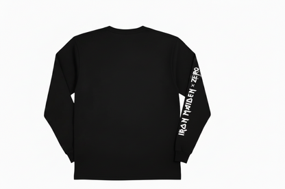A black long-sleeve t-shirt with 'IRON MAIDEN x ZERO' printed in a white distressed font across the upper back, with the text continuing down the right sleeve, shown against a plain white background.