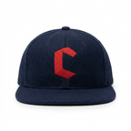 Straight-on front view of the navy and red Crown cap